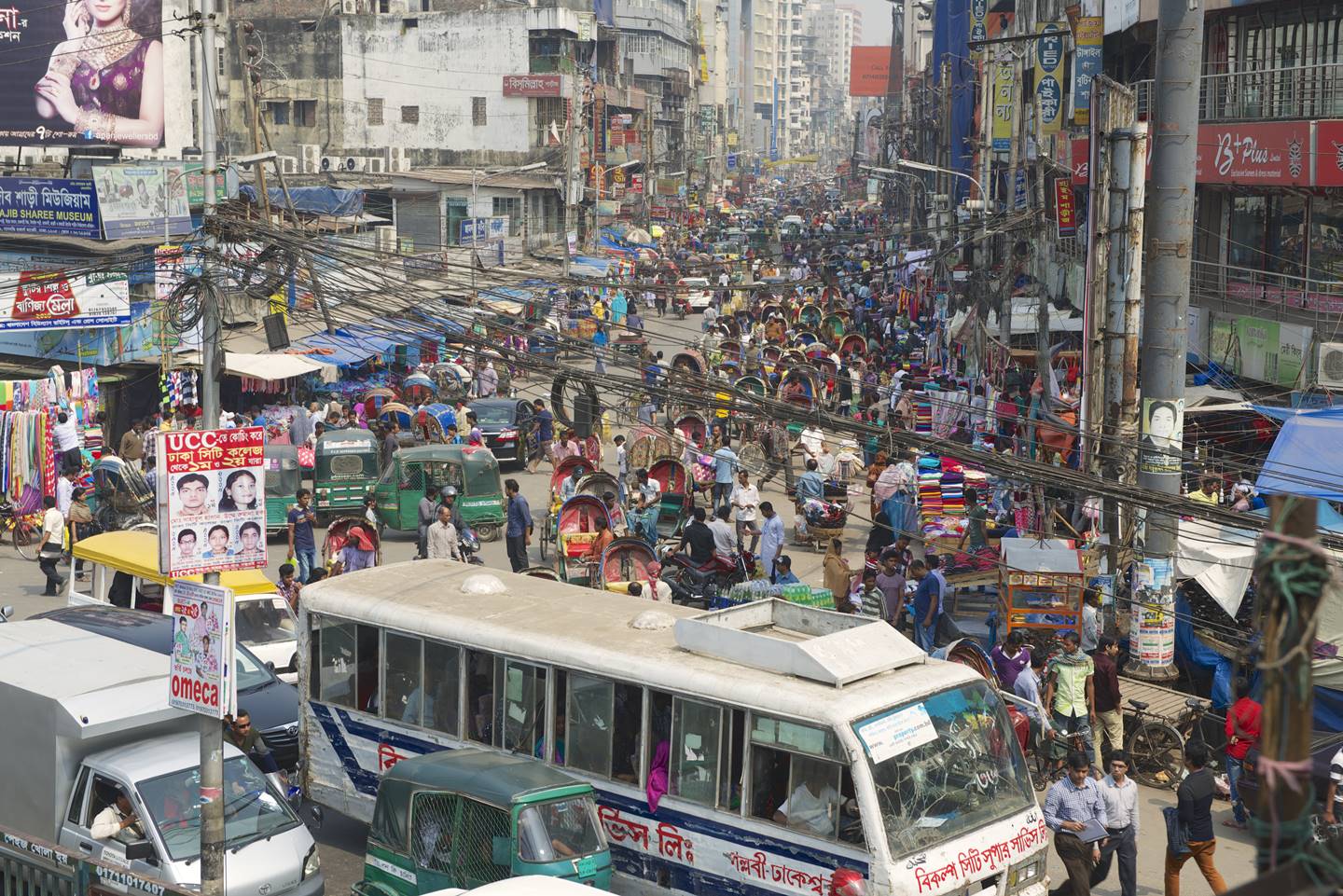 big crowd and vehicles in dhaka