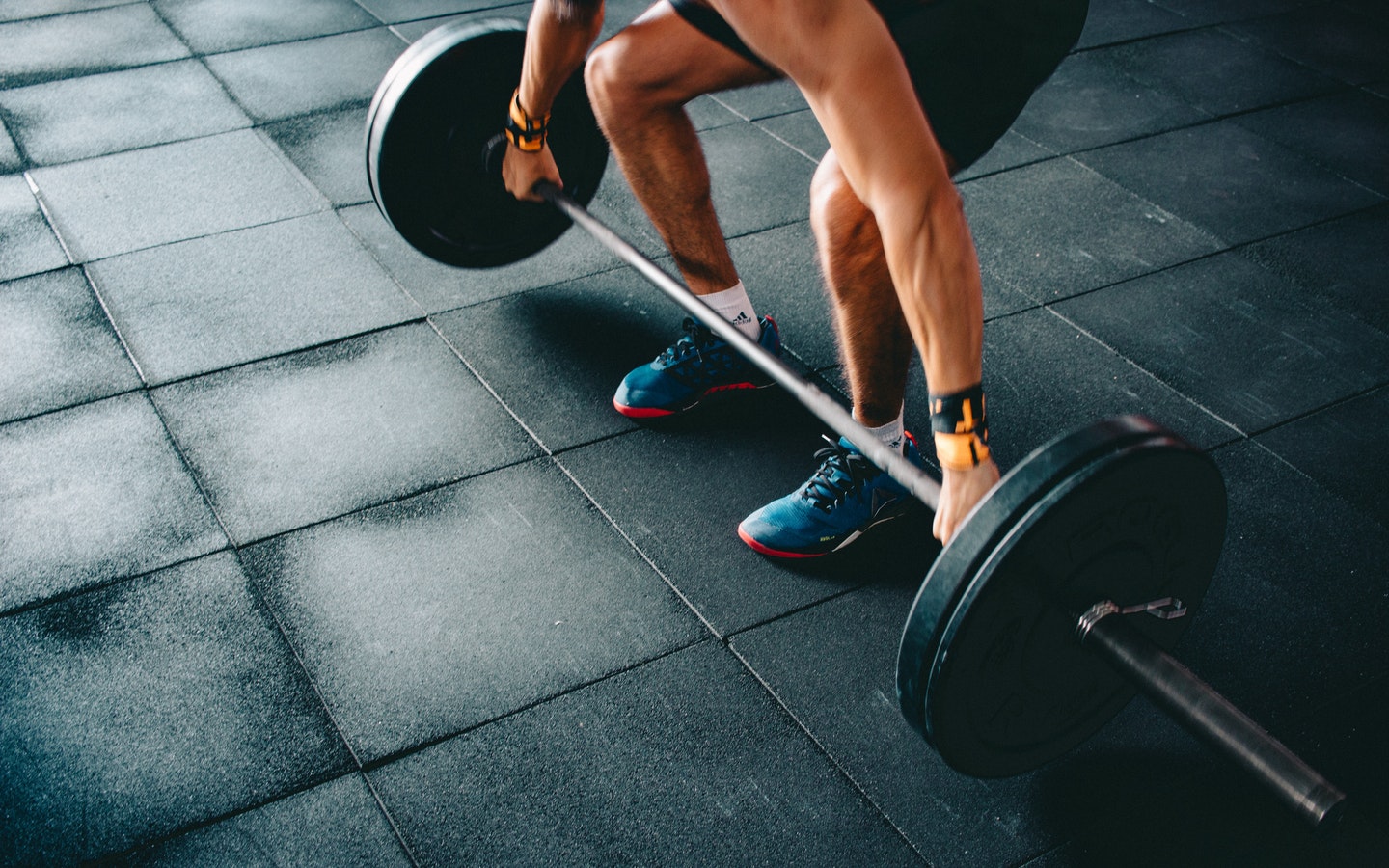 Man lifting barbell with weights