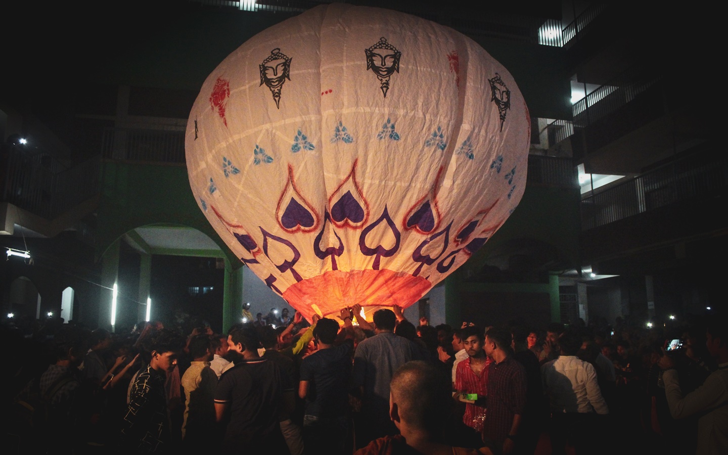 People inflating air balloon for celebrtation